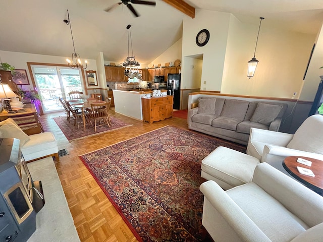 25 Cobblewood Dr, Mount Pocono, PA 18344 - living area featuring a chandelier, beamed ceiling, a ceiling fan, and high vaulted ceiling