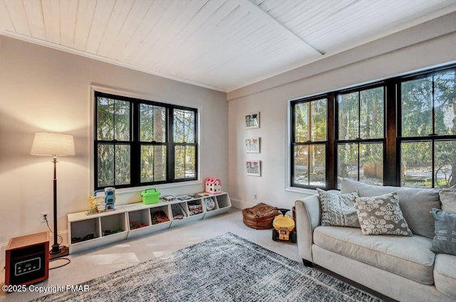 interior space with wooden ceiling, crown molding, baseboards, and carpet flooring