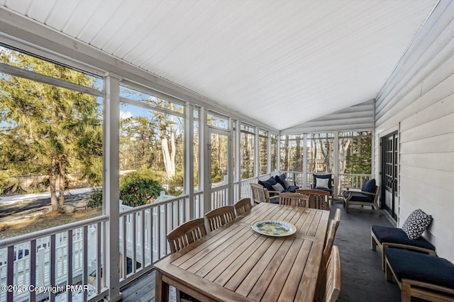 sunroom / solarium with vaulted ceiling