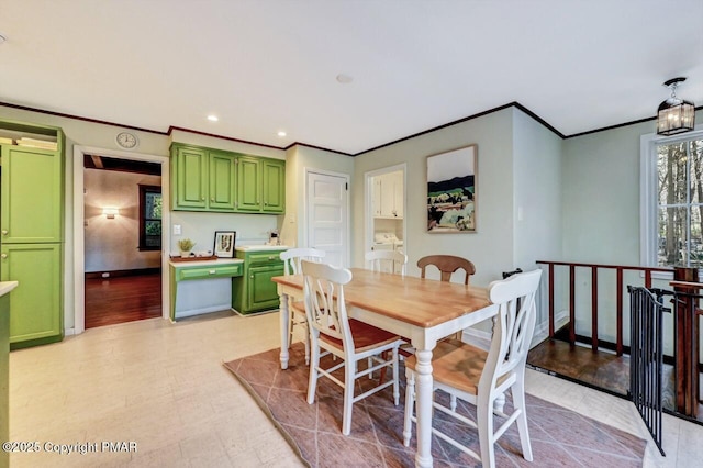 dining area featuring recessed lighting, crown molding, and baseboards