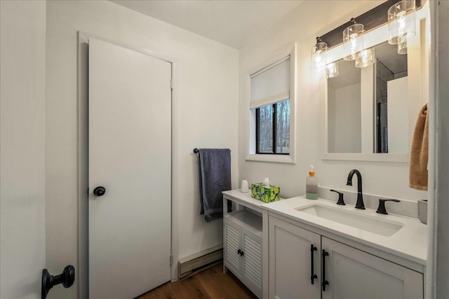 62 Locust Ln, Gouldsboro, PA 18424 - bathroom with wood finished floors, vanity, and baseboard heating