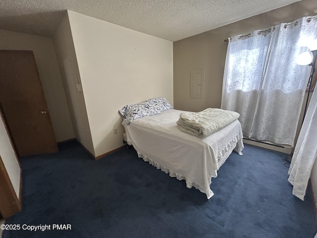 bedroom with baseboards, baseboard heating, carpet flooring, and a textured ceiling