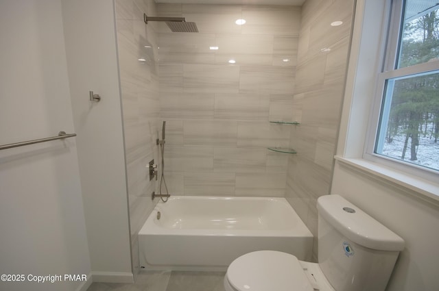 full bathroom featuring bathtub / shower combination, toilet, and a healthy amount of sunlight