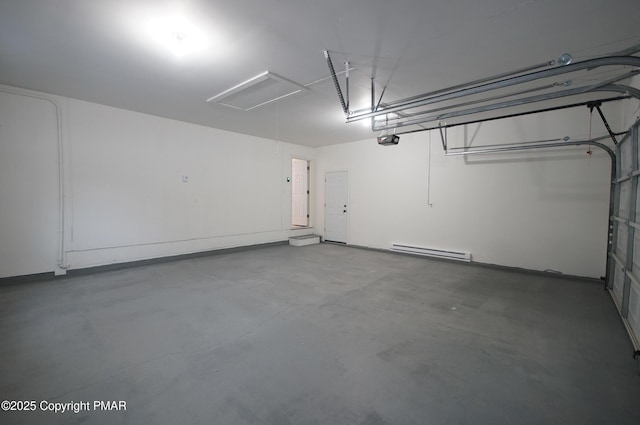 garage featuring a baseboard heating unit and a garage door opener