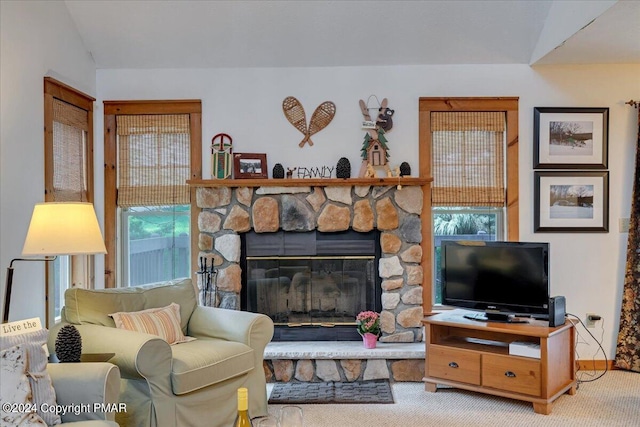 carpeted living room featuring a fireplace