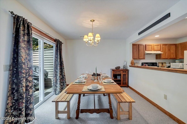 dining space with light carpet, baseboards, and a notable chandelier