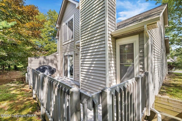 view of property exterior featuring a chimney