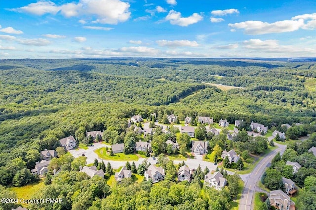 bird's eye view with a forest view and a residential view