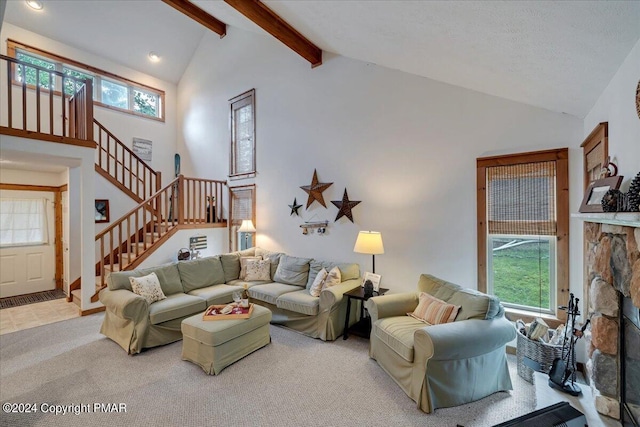 carpeted living room featuring stairway, a stone fireplace, high vaulted ceiling, beam ceiling, and recessed lighting