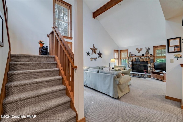 living room featuring high vaulted ceiling, a wealth of natural light, beam ceiling, and carpet floors