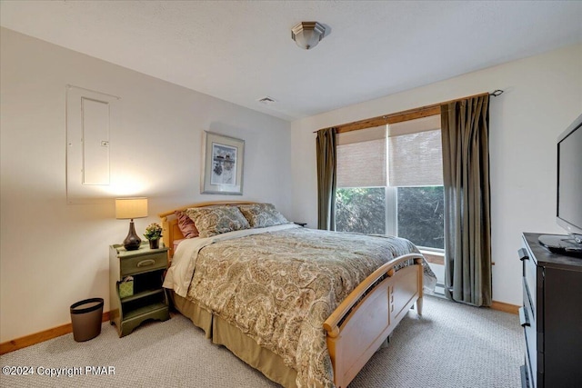 bedroom with light colored carpet, visible vents, and baseboards