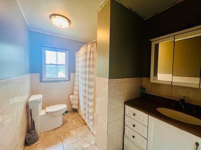 2121 Sassafras Ln, Kunkletown, PA 18058 - bathroom with tile walls, tile patterned flooring, wainscoting, and toilet