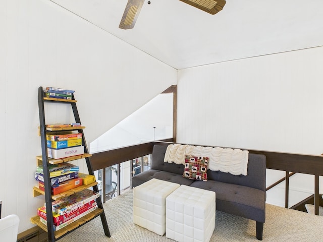 carpeted living area featuring ceiling fan