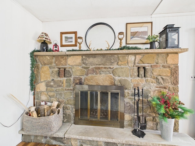 interior details featuring crown molding and a fireplace