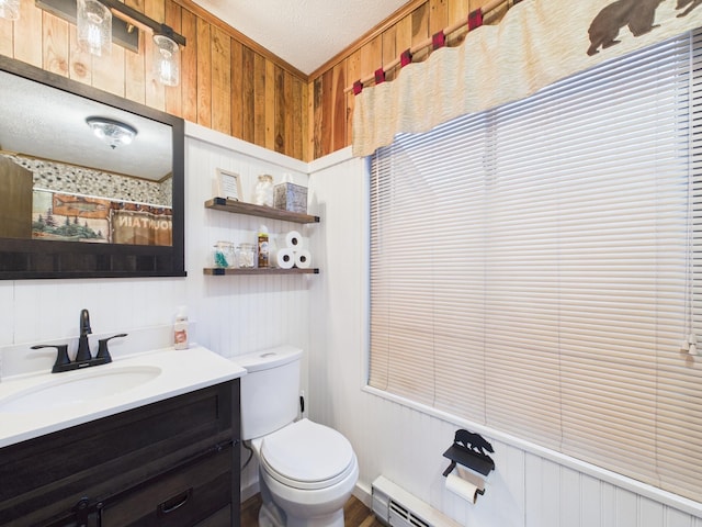 full bath featuring a textured ceiling, vanity, and toilet