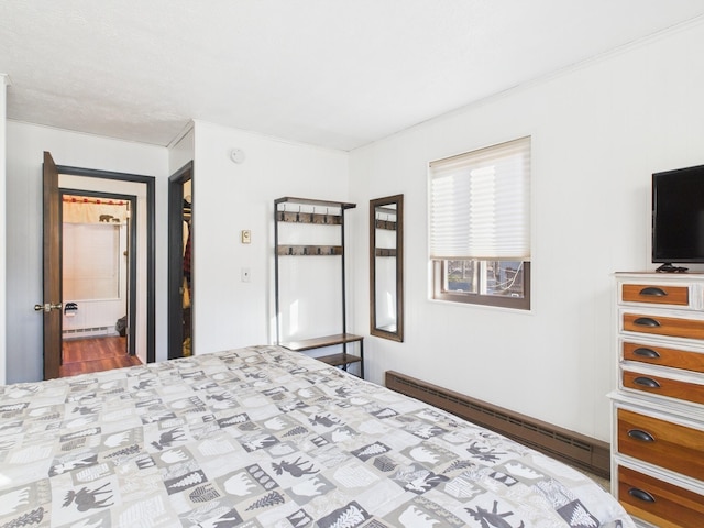 bedroom with a baseboard heating unit