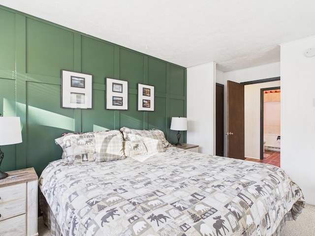 bedroom featuring a decorative wall