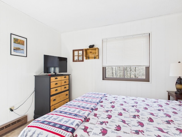 bedroom featuring a baseboard heating unit