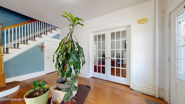 1220 Wyoming Ave, Forty Fort, PA 18704 - foyer with stairway, french doors, and wood finished floors