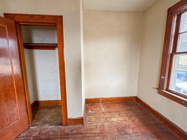 unfurnished bedroom featuring baseboards