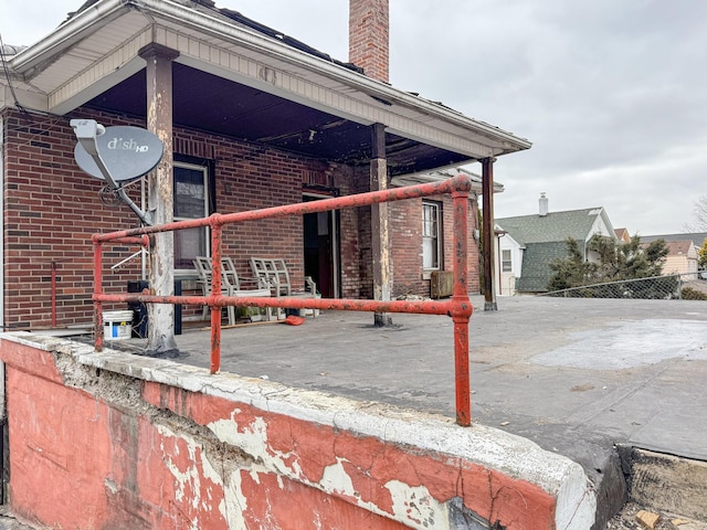 exterior space featuring brick siding