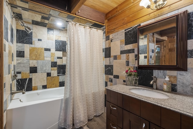 65 Poho Cir, Lehighton, PA 18235 - bathroom featuring vanity, shower / bathtub combination with curtain, decorative backsplash, and tile walls