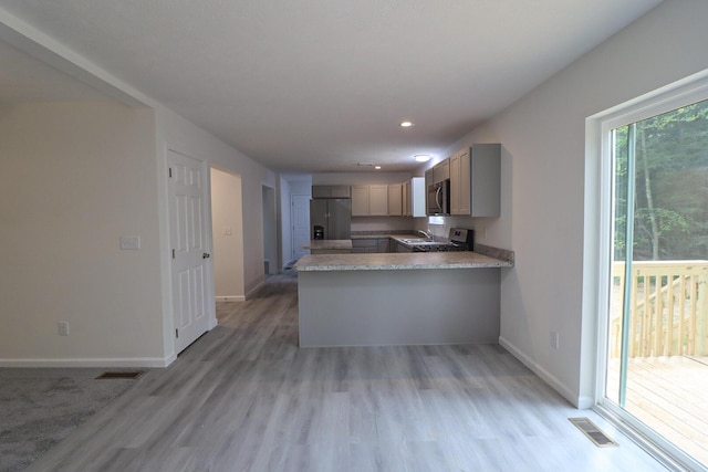 8305 Utopia Ln, East Stroudsburg, PA 18302 - kitchen with appliances with stainless steel finishes, light wood-style flooring, baseboards, and recessed lighting
