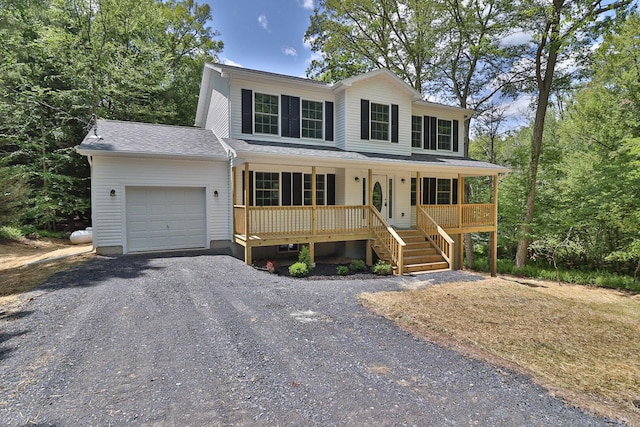 8305 Utopia Ln, East Stroudsburg, PA 18302 - view of front of house with an attached garage, a porch, gravel driveway, and stairway