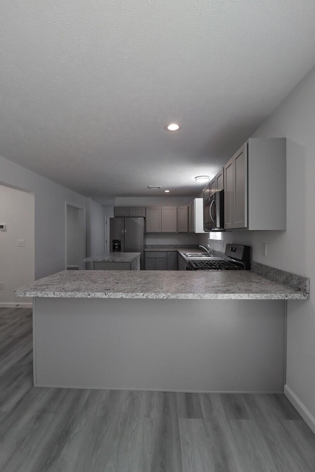 8305 Utopia Ln, East Stroudsburg, PA 18302 - kitchen featuring fridge with ice dispenser, baseboards, wood finished floors, recessed lighting, and gray cabinets
