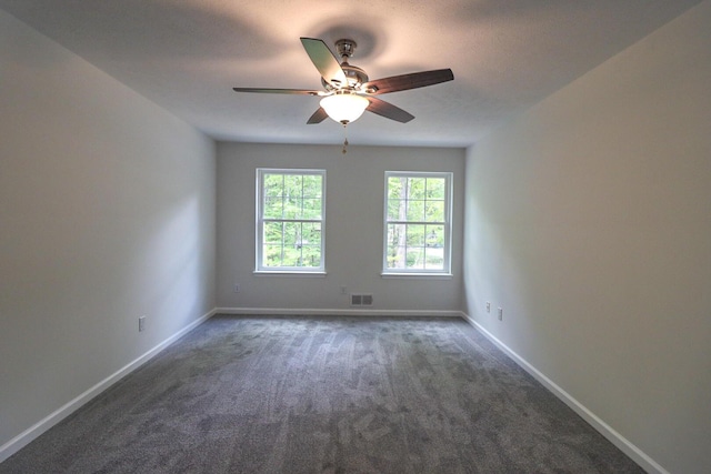 8305 Utopia Ln, East Stroudsburg, PA 18302 - empty room featuring dark colored carpet, a ceiling fan, and baseboards