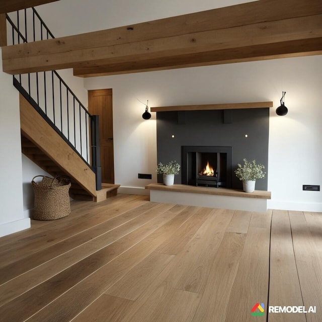 1119 Porter Dr, Bushkill, PA 18324 - unfurnished living room featuring wood finished floors, stairs, beam ceiling, and a warm lit fireplace