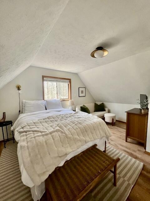 460 Maxatawny Dr, Pocono Lake, PA 18347 - bedroom featuring lofted ceiling and a textured ceiling