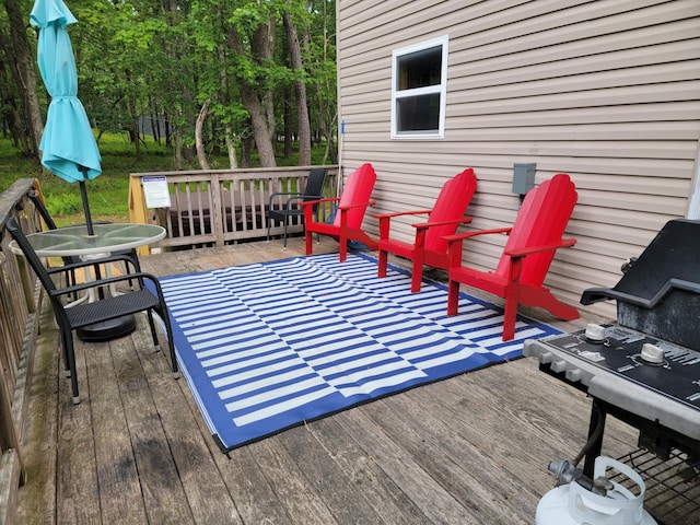 wooden terrace with outdoor dining area
