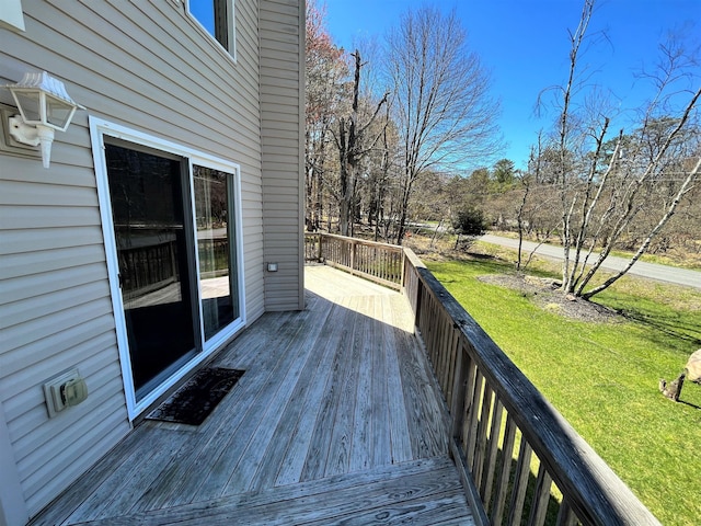 wooden deck with a yard