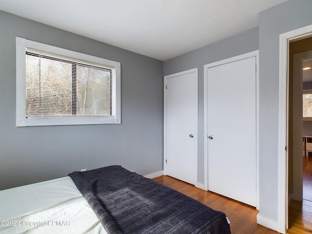 bedroom with wood finished floors