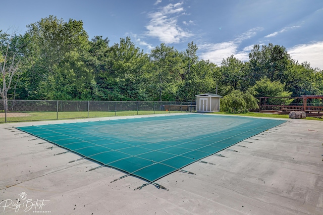 8066 Red Squirrel Dr, Tobyhanna, PA 18466 - view of pool with a storage shed, an outdoor structure, fence, and a fenced in pool
