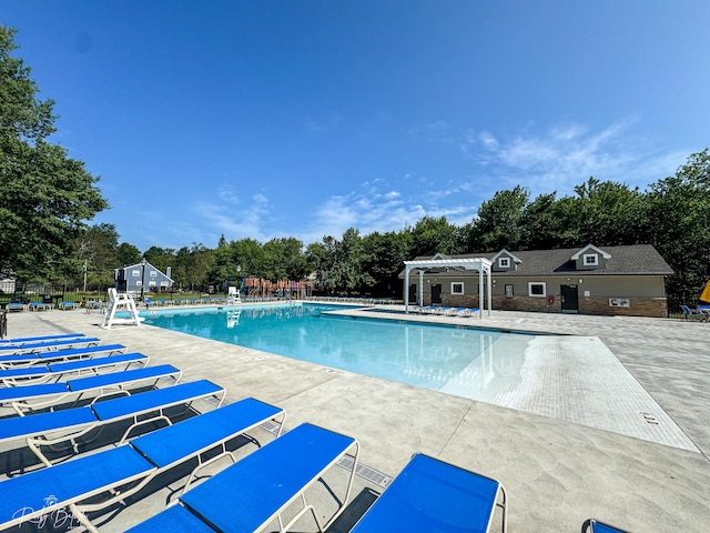 8066 Red Squirrel Dr, Tobyhanna, PA 18466 - pool with a pergola, fence, and a patio area