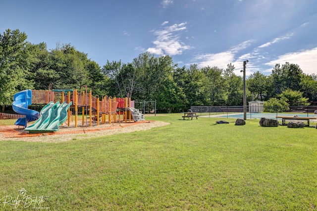 8066 Red Squirrel Dr, Tobyhanna, PA 18466 - community play area with a yard, fence, and a storage unit