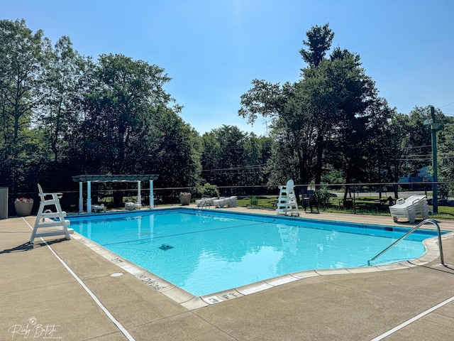 8066 Red Squirrel Dr, Tobyhanna, PA 18466 - community pool featuring a pergola, fence, and a patio