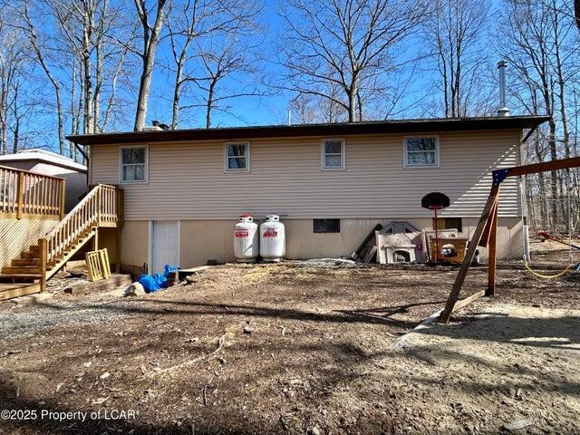 8 Tulip Ln, Thornhurst, PA 18424 - back of house featuring stairway