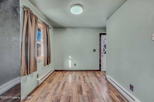 8 Tulip Ln, Thornhurst, PA 18424 - empty room featuring a baseboard radiator and wood finished floors