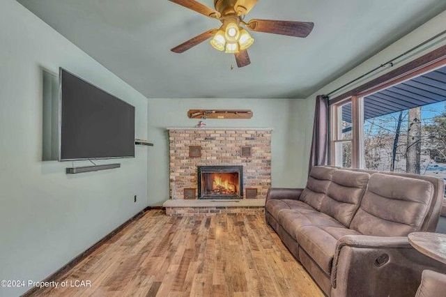 8 Tulip Ln, Thornhurst, PA 18424 - living room with wood finished floors, a brick fireplace, and ceiling fan