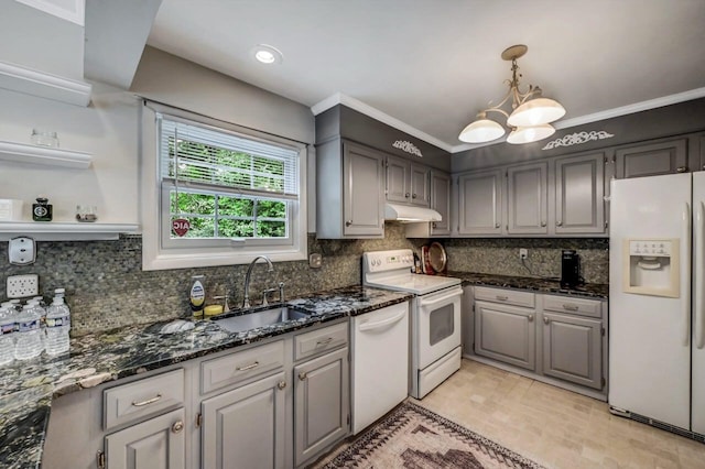 14 Ace Ln, East Stroudsburg, PA 18301 - kitchen featuring white appliances, under cabinet range hood, a sink, a chandelier, and decorative backsplash
