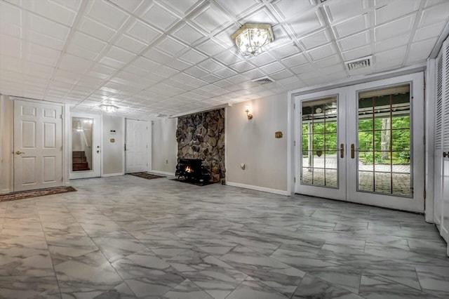 14 Ace Ln, East Stroudsburg, PA 18301 - unfurnished living room featuring french doors, marble look tiles, and baseboards