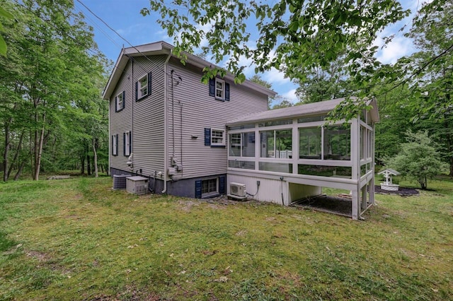 14 Ace Ln, East Stroudsburg, PA 18301 - back of house featuring a sunroom, a yard, and central air condition unit