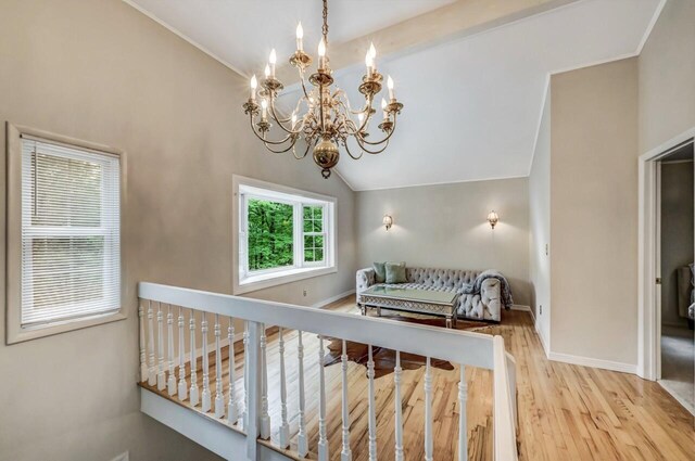 14 Ace Ln, East Stroudsburg, PA 18301 - staircase featuring a chandelier, wood finished floors, lofted ceiling, and baseboards