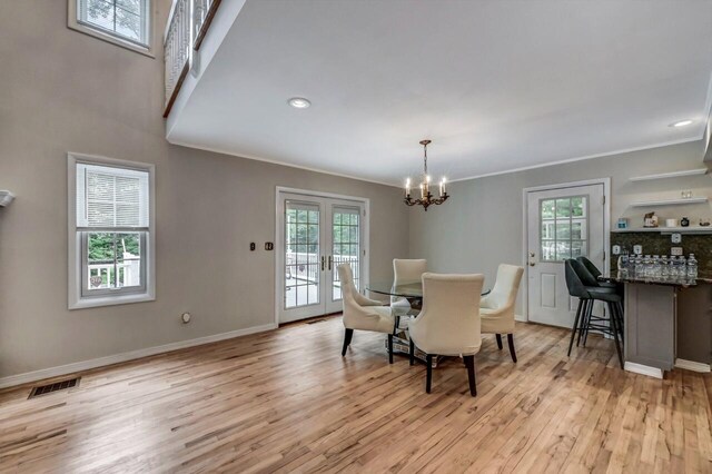 14 Ace Ln, East Stroudsburg, PA 18301 - dining room with plenty of natural light, light wood-type flooring, a chandelier, ornamental molding, and baseboards