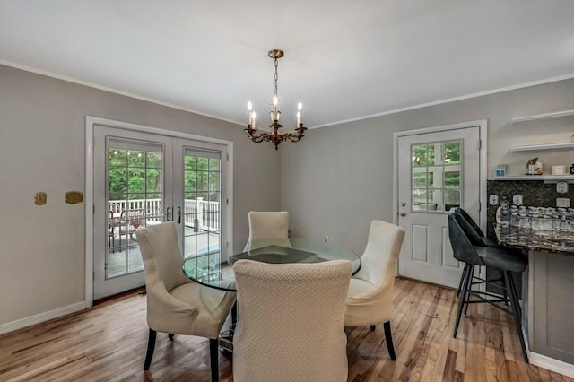 14 Ace Ln, East Stroudsburg, PA 18301 - dining area with plenty of natural light, a chandelier, crown molding, light wood-style floors, and baseboards