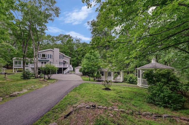 14 Ace Ln, East Stroudsburg, PA 18301 - view of front of house with a gazebo, a front yard, stairs, and a chimney
