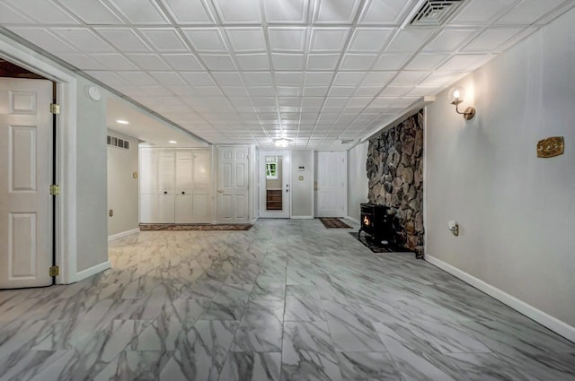 14 Ace Ln, East Stroudsburg, PA 18301 - unfurnished living room with baseboards, a wood stove, marble finish floors, and recessed lighting